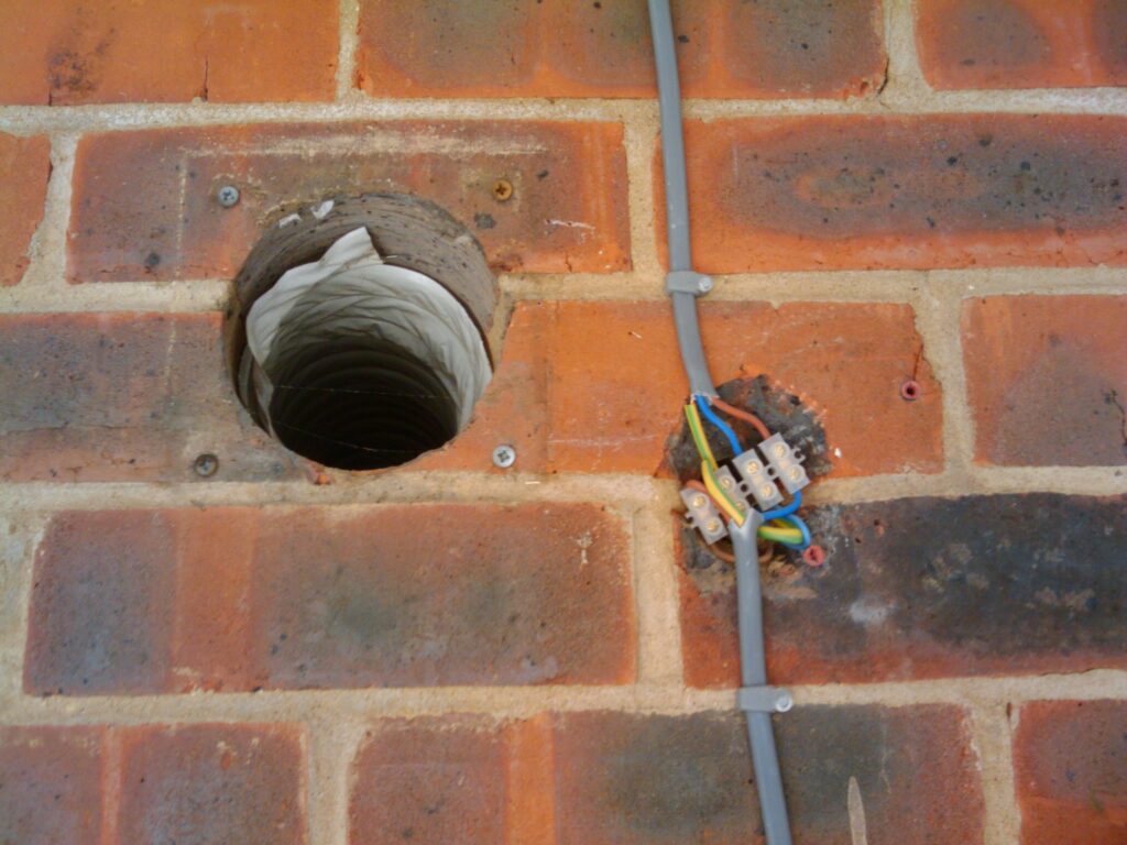 Old extractor fan outlet and light cables