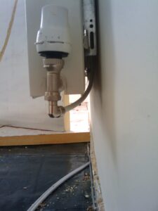 pipes behind radiator