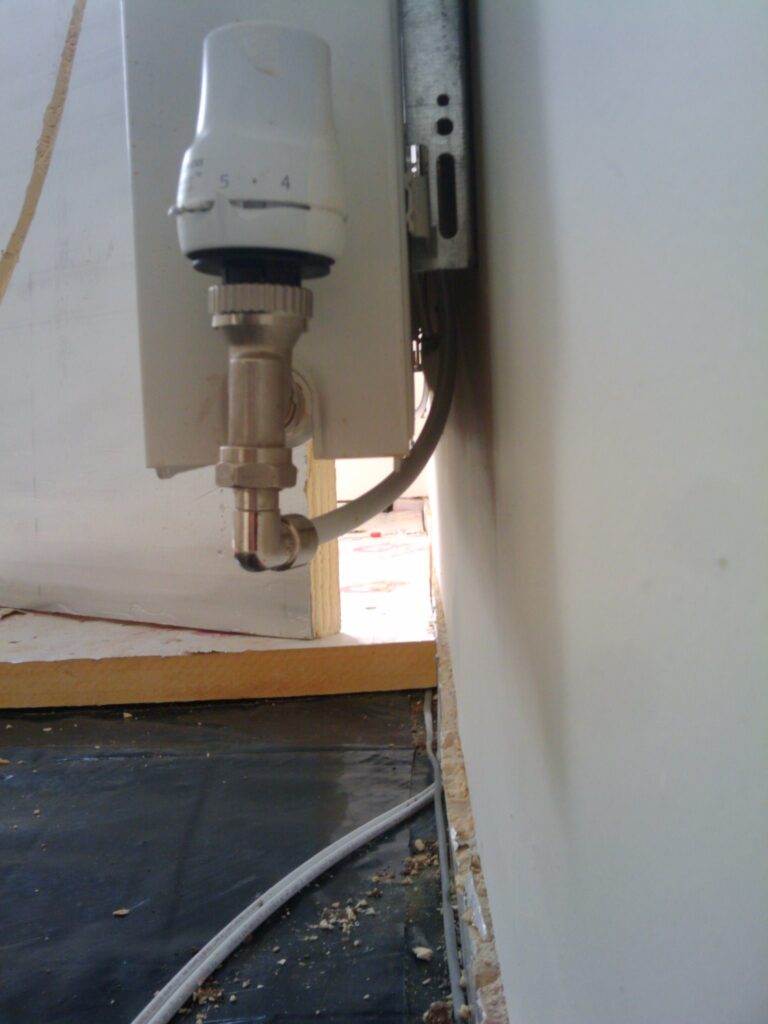 pipes behind radiator