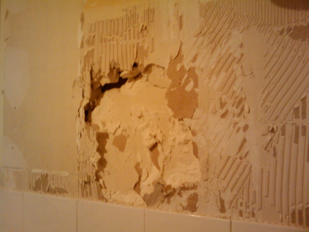 Barratt Homes attached the kitchen tiles direct to the plasterboard rather than plastering first. Removing them made a mess.