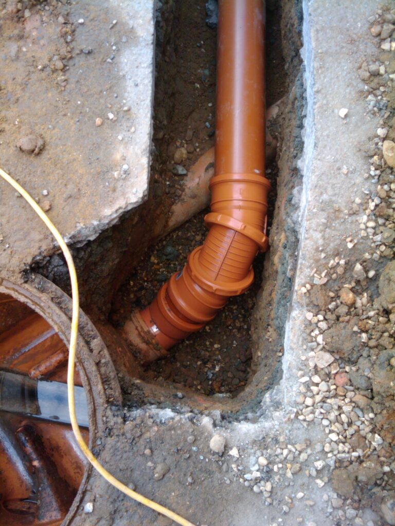 New pipe going over the toilet inlet, then down. Flow was tested, all good.