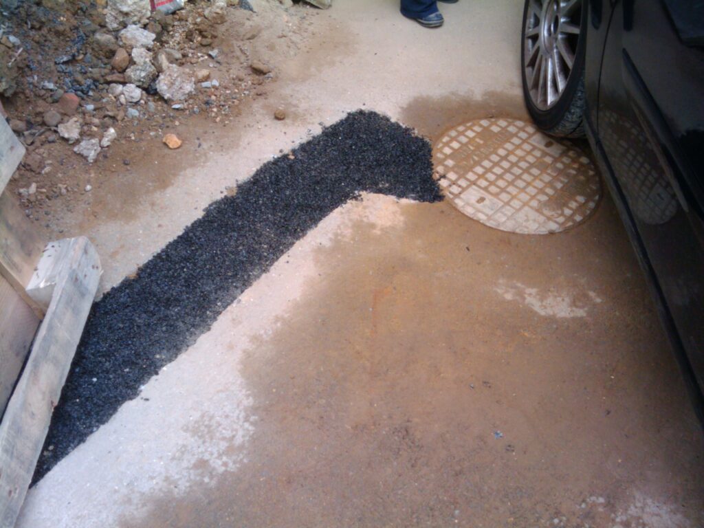 Fresh asphalt on the drive. Hopefully it will blend a little once the drive is steam cleaned.