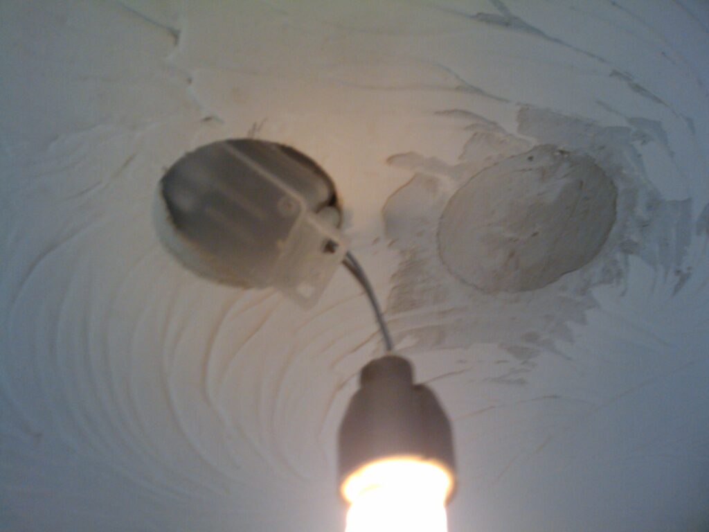 2 holes were made for this spotlight - the first found itself under the lintel