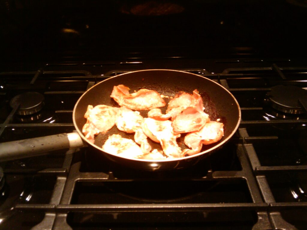 The first fried bacon on the big wok ring