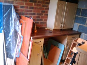 Old kitchen units used to make work bench in the garage