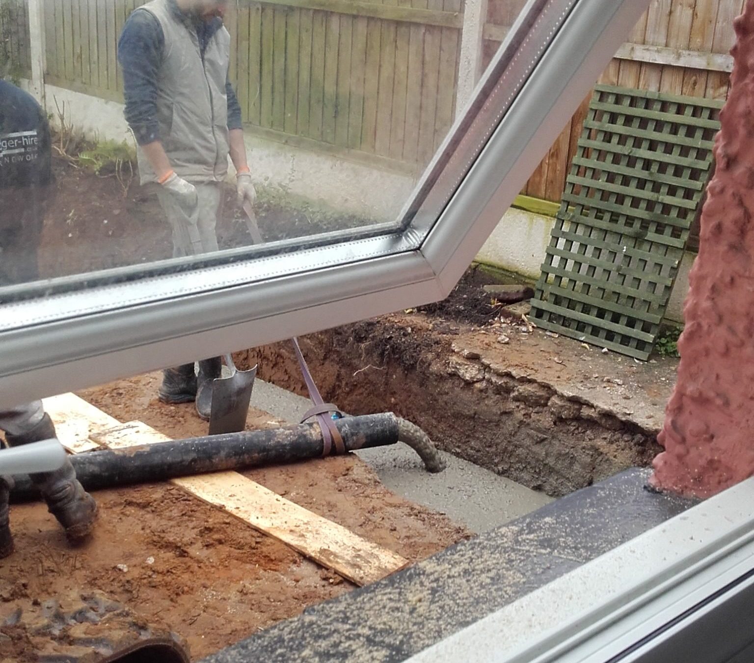 pumping concrete into trench