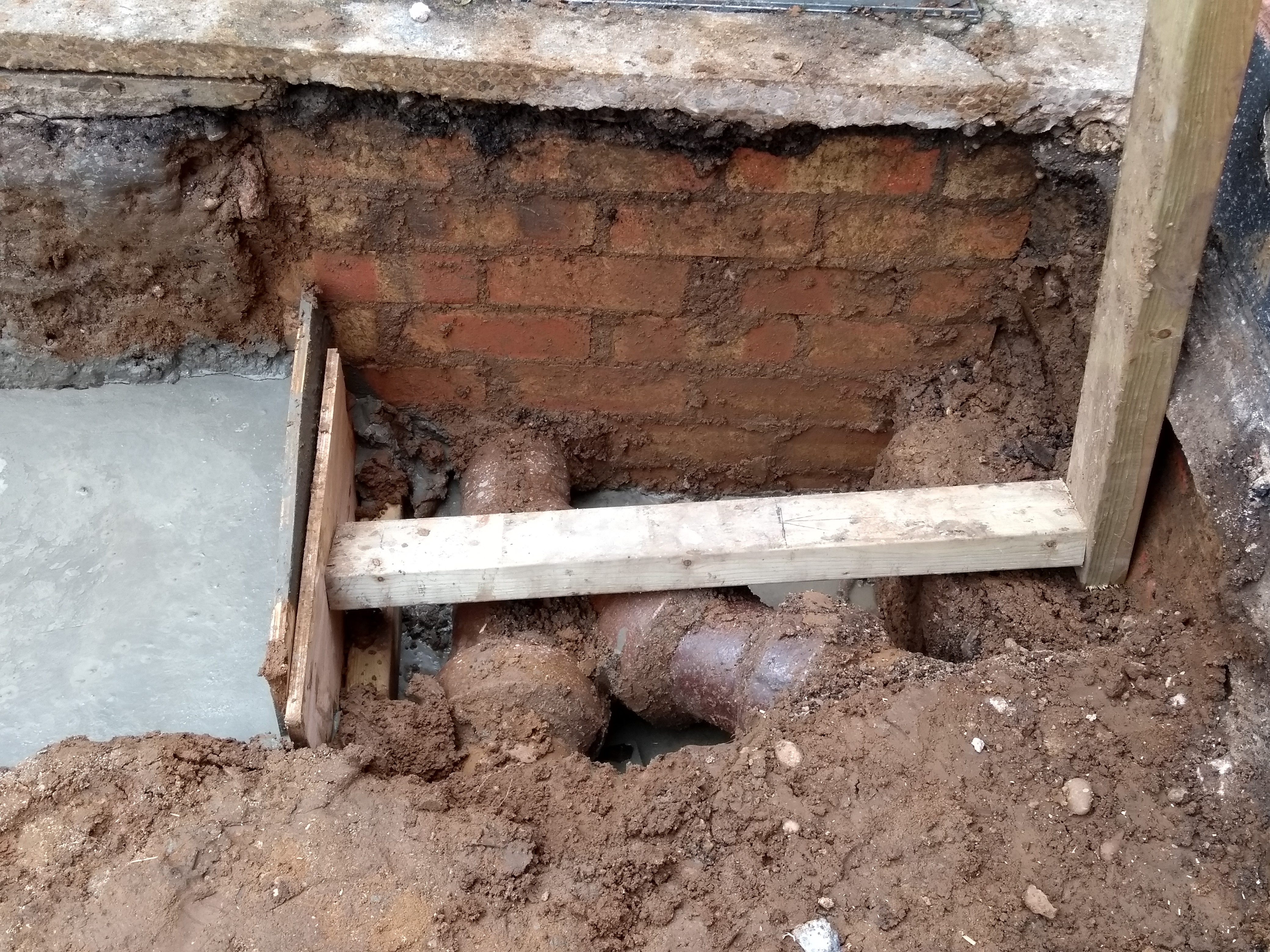 concrete poured around drainage pipes